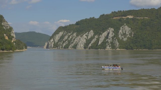 Kazan gorge entrance on river Danube from Romanian side 4K 2160p UHD footage - Enjoying on boats in Cazanele Danube river gorge 4K 3840X2160 UHD video