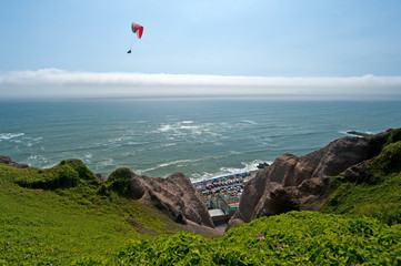 Paraglider over Pacific Ocean in Lima, Peru