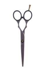 Hairdressing scissors on a white background close-up