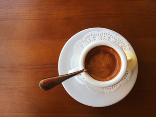 Small coffee cup with space on the old wooden table