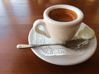 Small coffee cup with space on the old wooden table