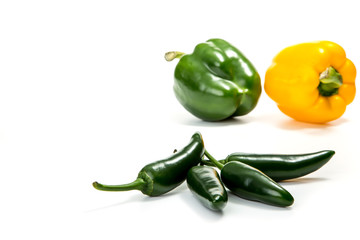 Jalapeno hot pepper and paprika on a white background