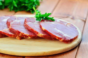 Sausage delicacy is cut on a cutting board