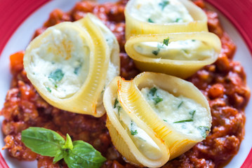 Lumaconi stuffed with ricotta with bolognese sauce