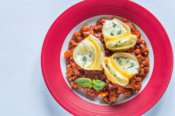 Lumaconi stuffed with ricotta with bolognese sauce