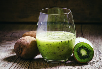 Freshly squeezed Smoothies kiwi fruit in a large glass, vintage