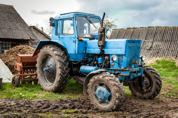 Old blue Belarus tractor on a ground