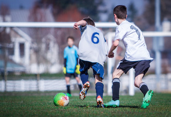 Fototapeta premium Boys playing soccer