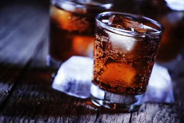 Alcoholic cocktail bourbon cola with whiskey and ice cubes, vint