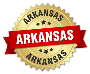 Arkansas round golden badge with red ribbon
