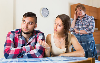 Home conflict at young family with mother