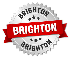 Brighton round silver badge with red ribbon