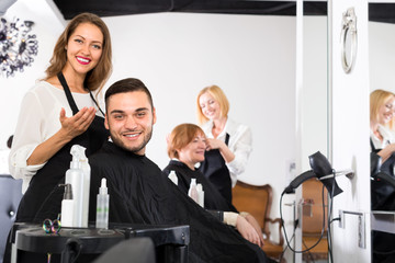 Hair stylist has done a haircut for man