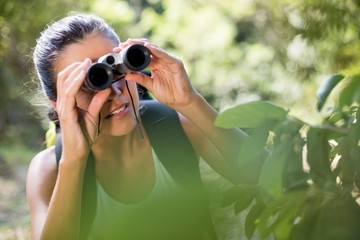Fototapeta na wymiar Woman looking something with binoculars 