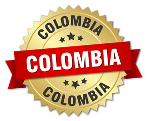 Colombia round golden badge with red ribbon