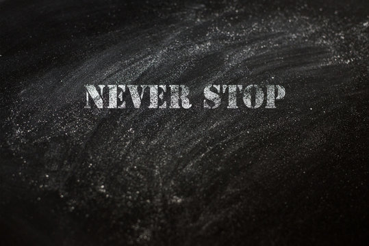 black chalk board with text never stop