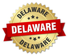 Delaware round golden badge with red ribbon