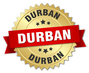 Durban round golden badge with red ribbon