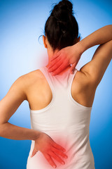 Fototapeta na wymiar Woman having pain in her back - back injury