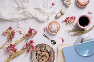 Fototapeta na wymiar Romantic french or rural breakfast. Cupcakes, coffee, quail eggs. White background, copy space.