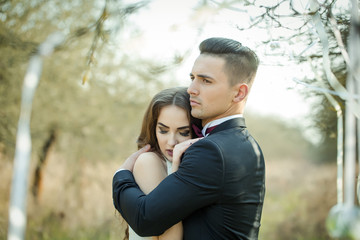 Fototapeta premium Wedding couple and ribbons on tree