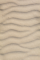 Fototapeta na wymiar sand structures on a windy day at the beach of Sitges, Spain