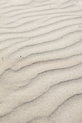 sand structures on a windy day at the beach of Sitges, Spain
