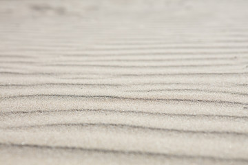 sand structures on a windy day at the beach of Sitges, Spain