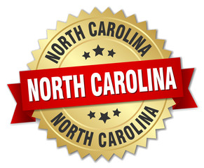 North Carolina round golden badge with red ribbon