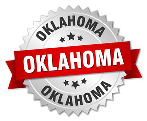 Oklahoma round silver badge with red ribbon