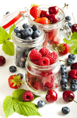 Summer berries in glass jar