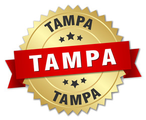 Tampa round golden badge with red ribbon