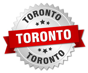 Toronto  round silver badge with red ribbon
