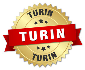 Turin round golden badge with red ribbon