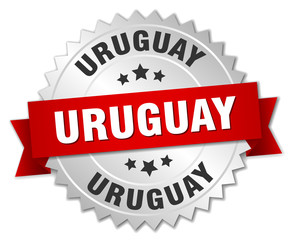 Uruguay round silver badge with red ribbon