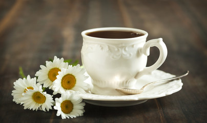 Cup of tea and chamomiles
