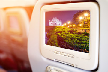 Aircraft monitor in passenger seat on Ruins of St. Paul's, one o