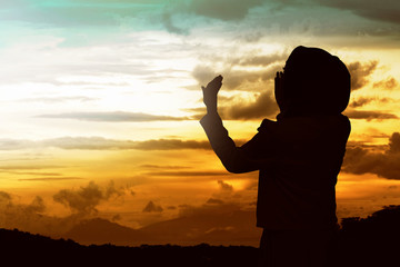 Back view of muslim woman praying