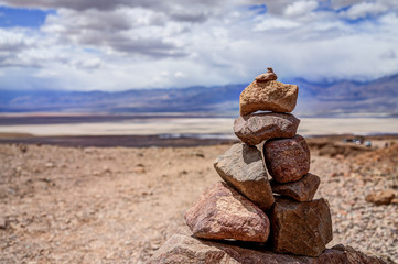 Fototapeta na wymiar Stone pyramid in Death Valley. Zen and harmony. Selective focus.