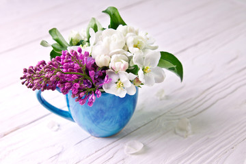 Spring flowers on wooden background