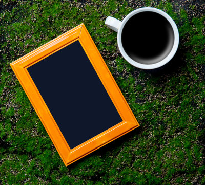 photo frame and cup of coffee