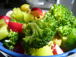 fresh vegetable salad with brocoli, pepper and olives