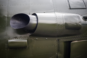 Close-up fragment of the old military plane. Fragment of old aircraft with rivets. Military background with rivets.