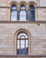 triple arched window of a renovated vintage building