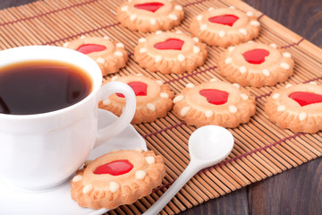 cookie with heart  jelly and cup of coffee bamboo napkin