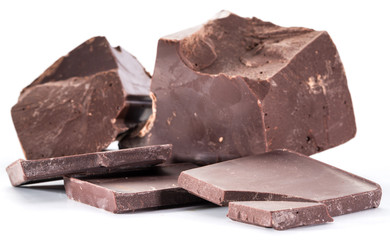 Chocolate blocks and pieces of chocolate bar isolated on a white