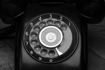 An old telephone with rotary dial