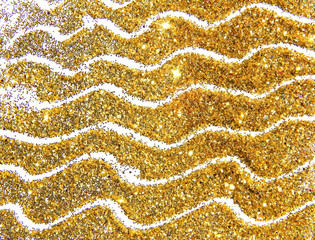 Golden glitter sparkle on white background