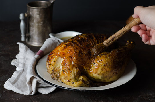 Roasted chicken with zatar or zaatar on dark background. Toned image. Selective focus. Arabic cuisine