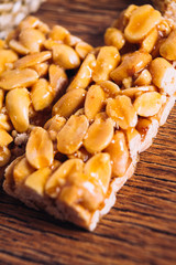 Kozinaki of peanut on a wooden background